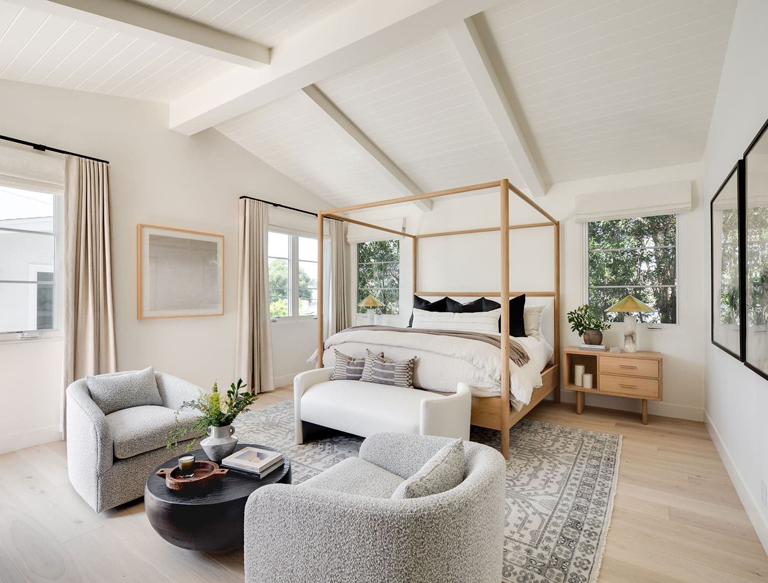 Bedroom with canopy bed and vaulted ceiling