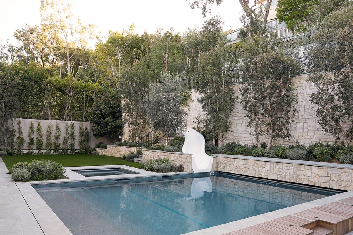 Pool and spa in the rear yard at dusk