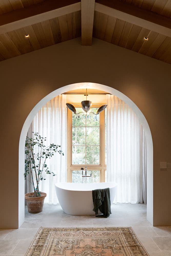 Arched niche with freestanding soaking tub