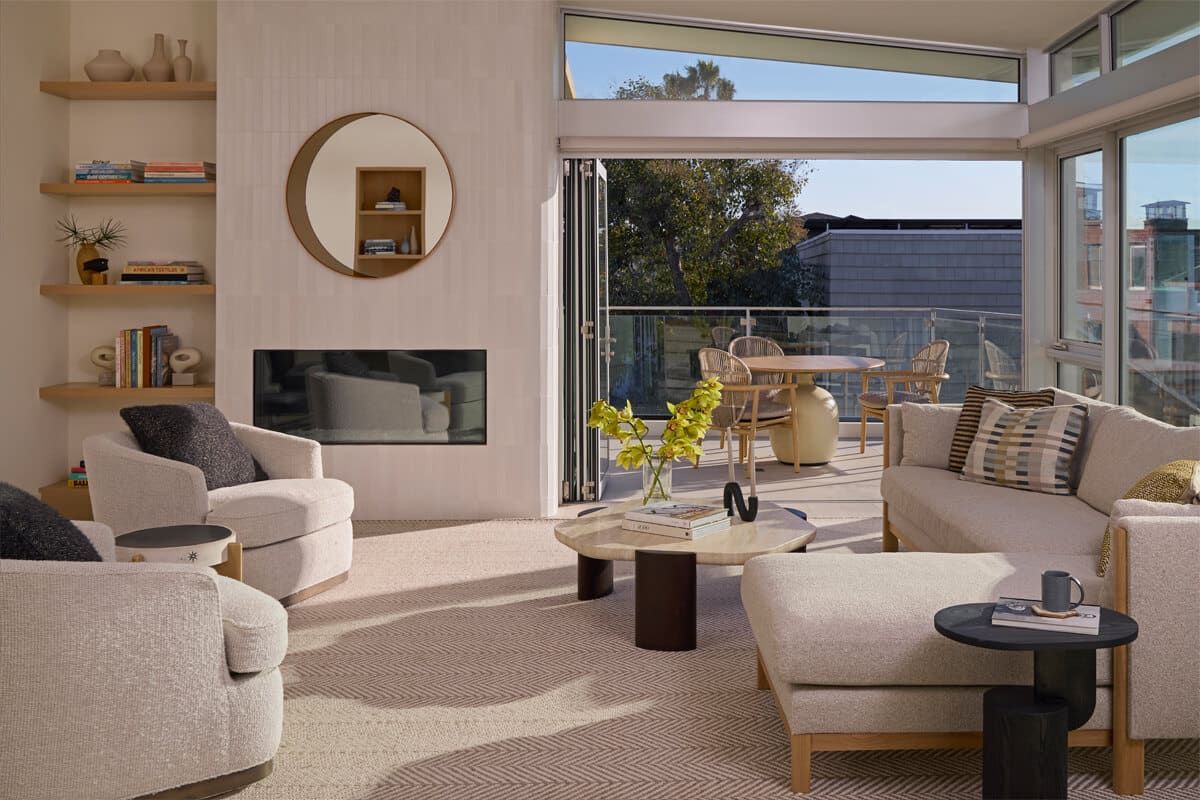 Living room opening to a coastal terrace