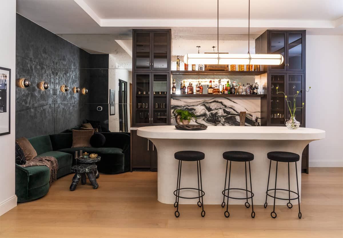 Custom bar with green velvet banquette