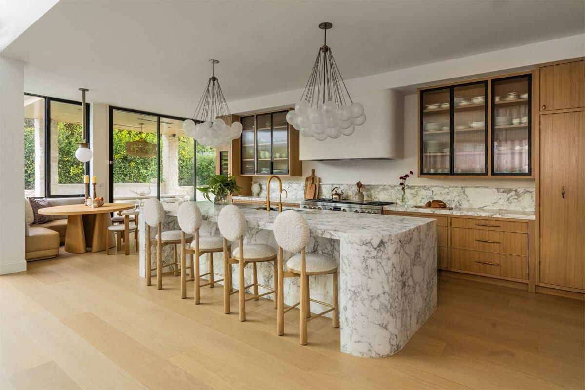 Chef's kitchen with marble island and oak cabinetry