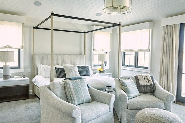 Primary bedroom with paneled walls