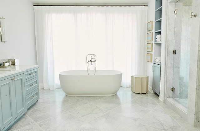 Primary bath with freestanding tub and marble