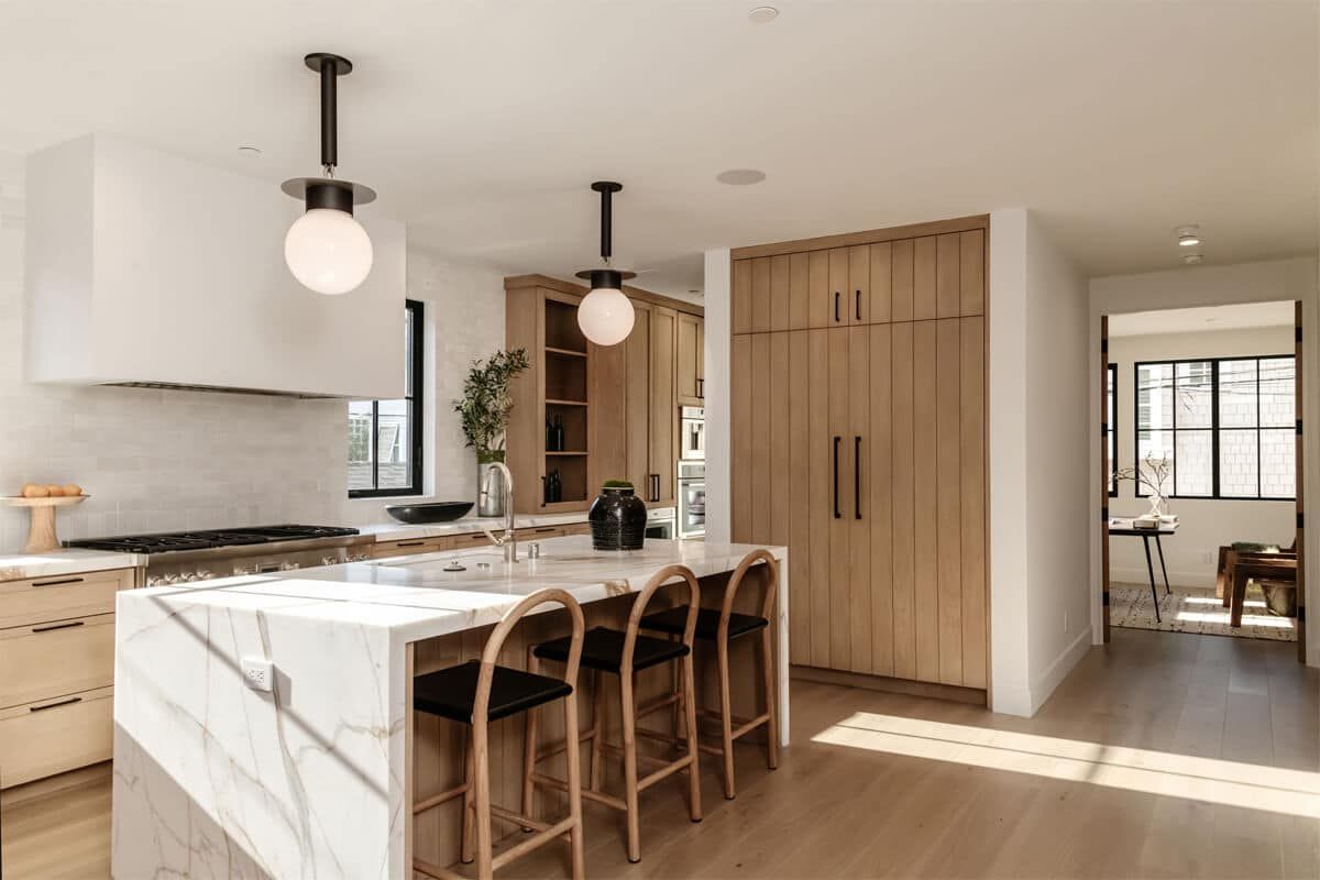 Kitchen with oak cabinetry and counter seating